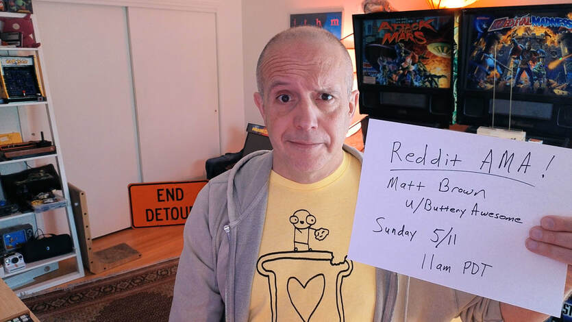 Matt holding a sign reading 'Reddit AMA! Sunday 5/11 11 a.m. PDT'